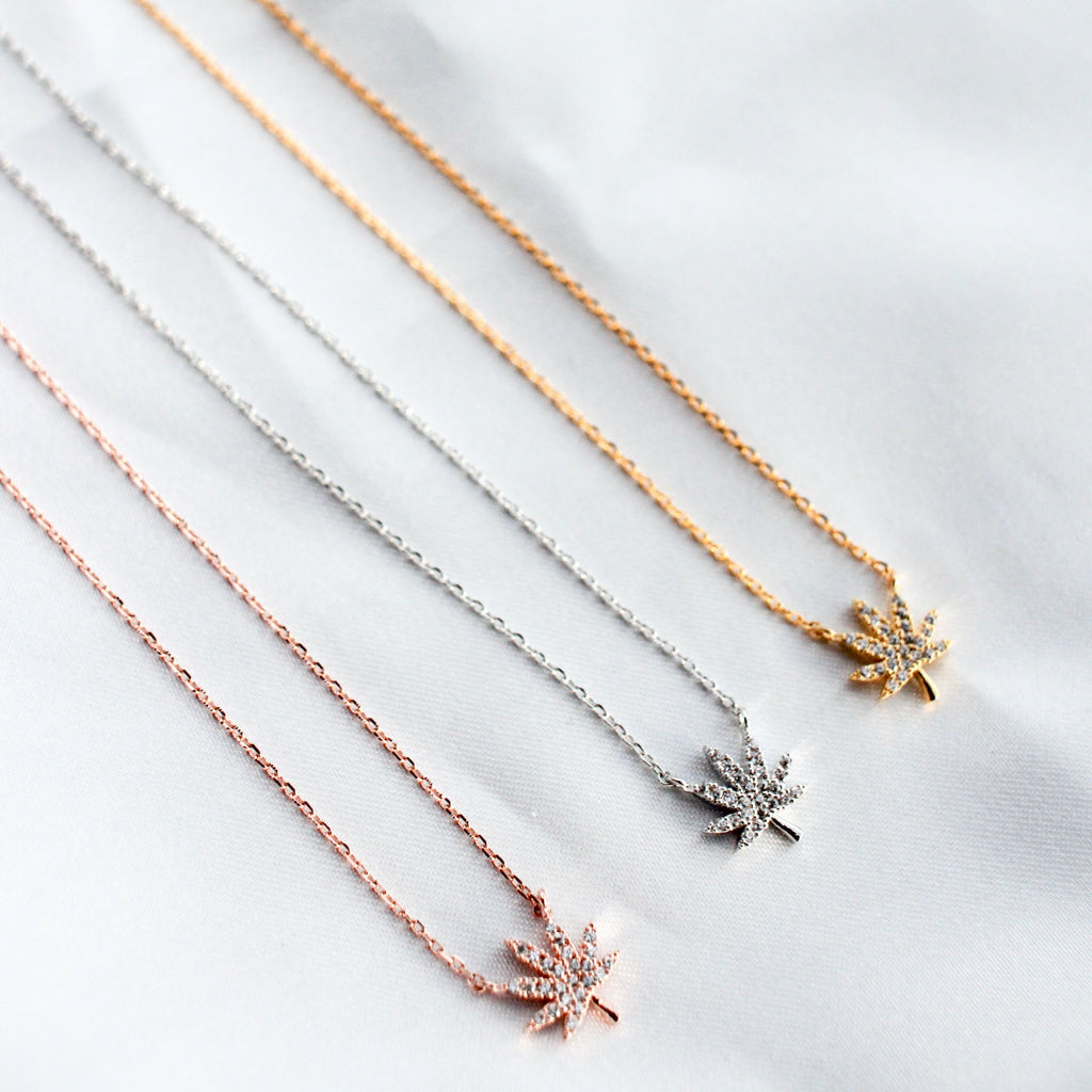 Rose Gold, Gold, and silver necklace with weed leaf detail